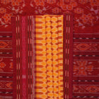 Full styling view of a model draped in a yellow and maroon Sambalpuri cotton saree with motifs.