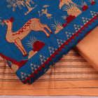 Close-up of the blouse piece showcasing the Doll pattern in blue and brown on cotton fabric.