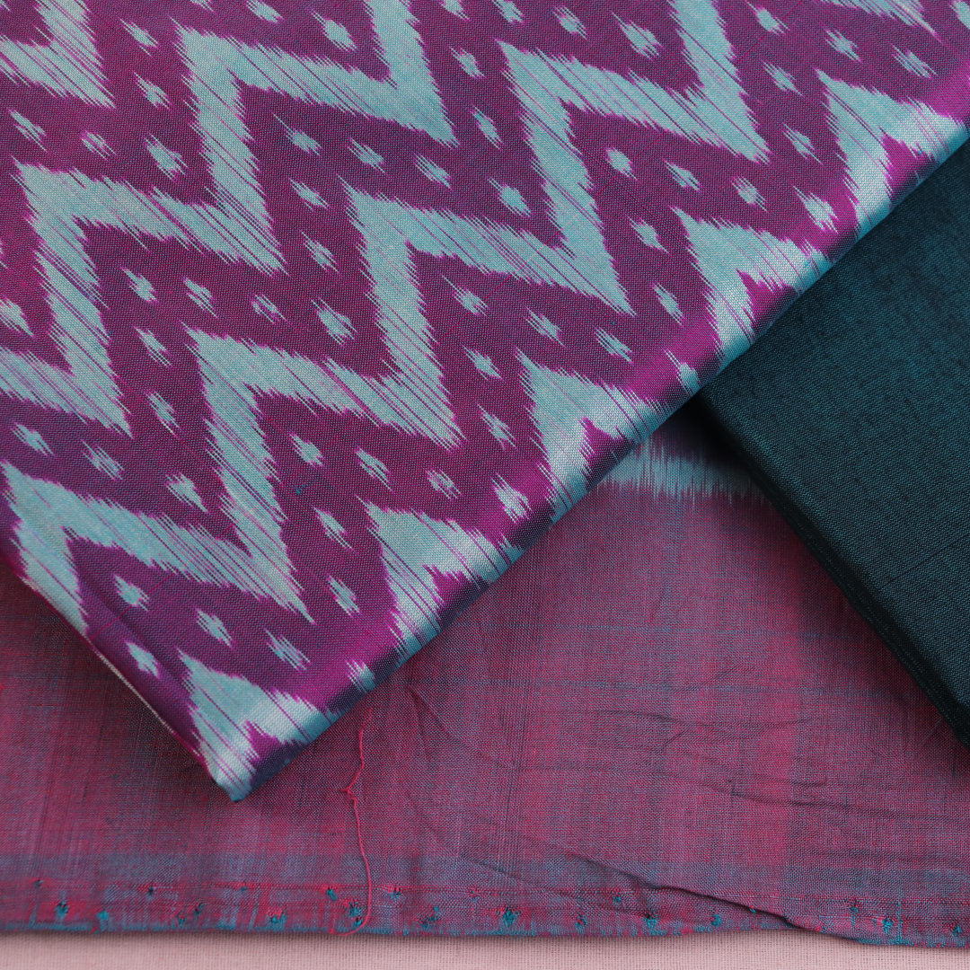 Sambalpuri silk dress material: Purple-green blouse piece with motif details.