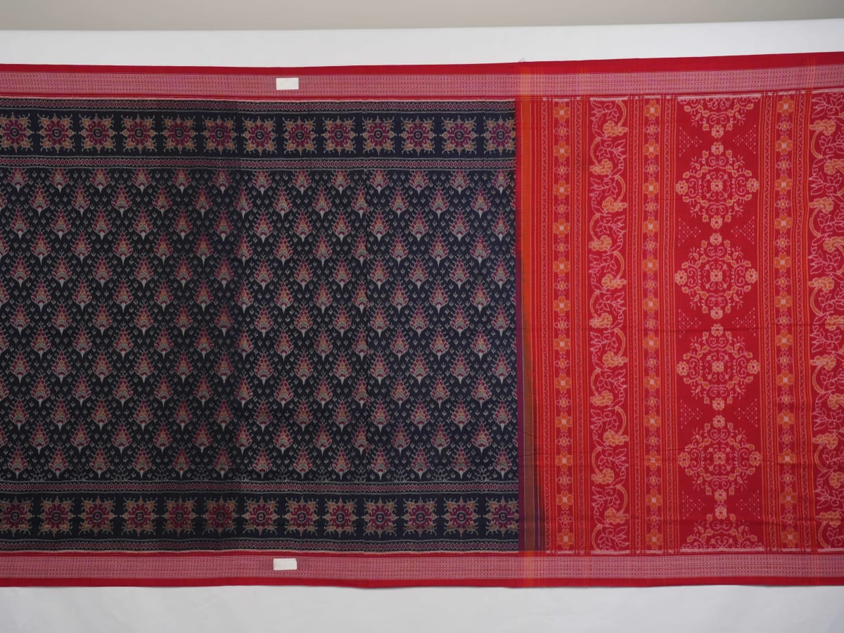 Full flat layout of a black and red Sambalpuri cotton saree showing the complete design, pallu, and border.