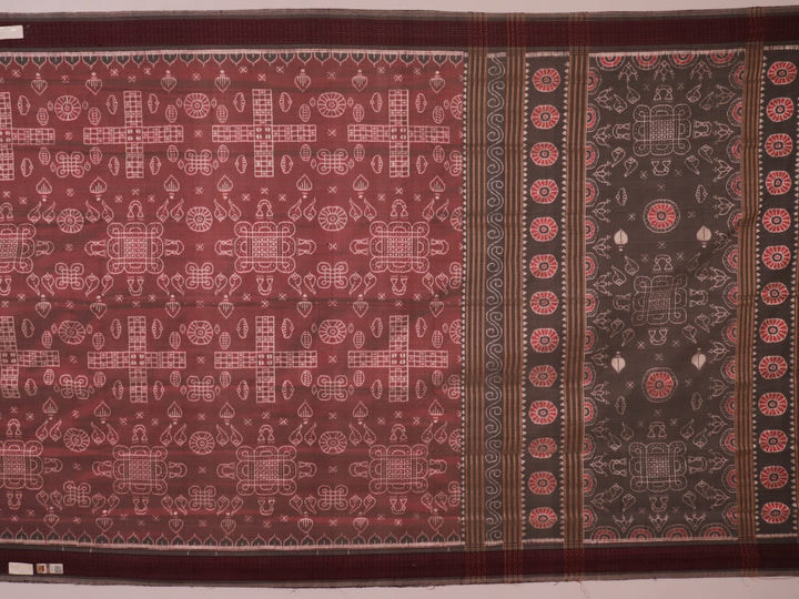 Close-up of a multicolored silk Sambalpuri saree fabric showing the intricate handloom texture and motifs.