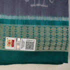 Extreme close-up of grey Sambalpuri silk fabric, revealing its fine handloom texture and weave quality.