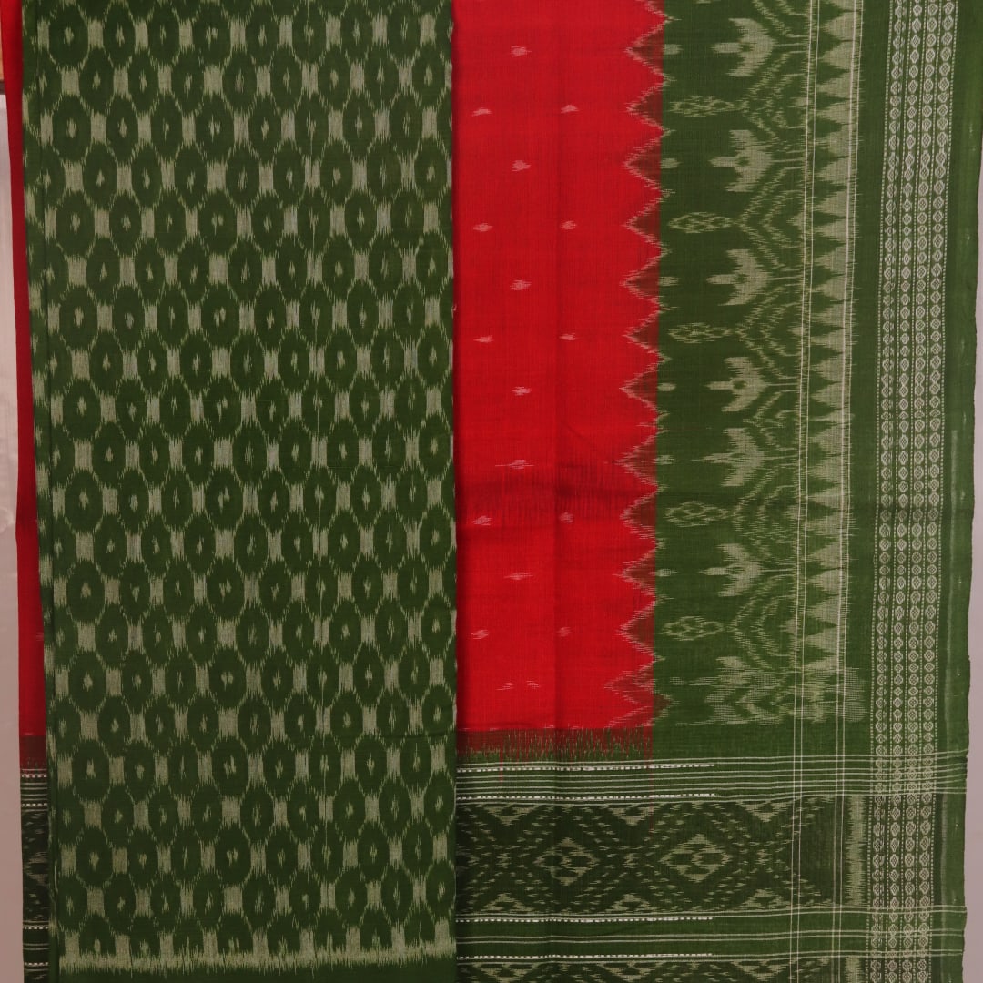 Close-up of the green Sambalpuri cotton dress material's blouse piece with red motifs.