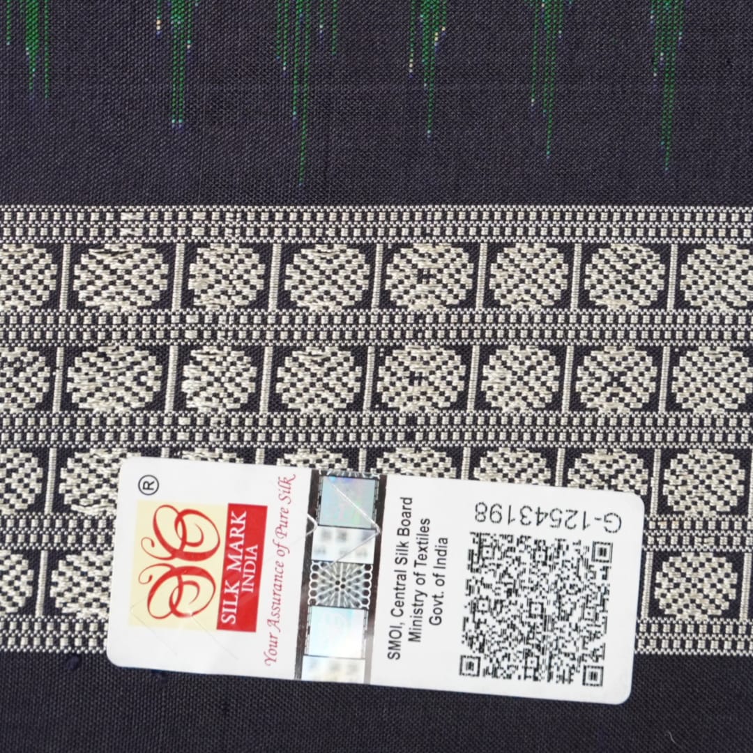 Close-up of Bomkai silk saree fabric, revealing rich texture and intricate handloom weave details.