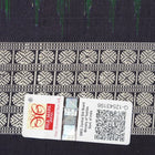Close-up of Bomkai silk saree fabric, revealing rich texture and intricate handloom weave details.