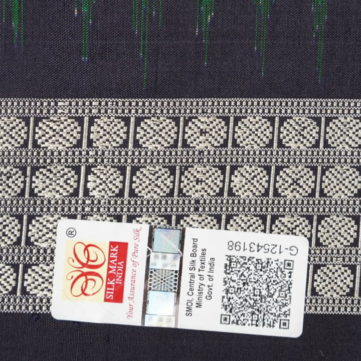 Close-up of Bomkai silk saree fabric, revealing rich texture and intricate handloom weave details.