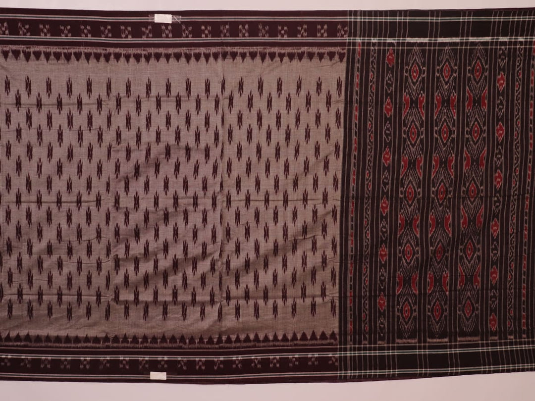 Elegantly draped grey Sambalpuri cotton saree with maroon motifs.