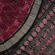 Detailed close-up of the maroon and black Sambalpuri silk saree's luxurious fabric texture and weave.