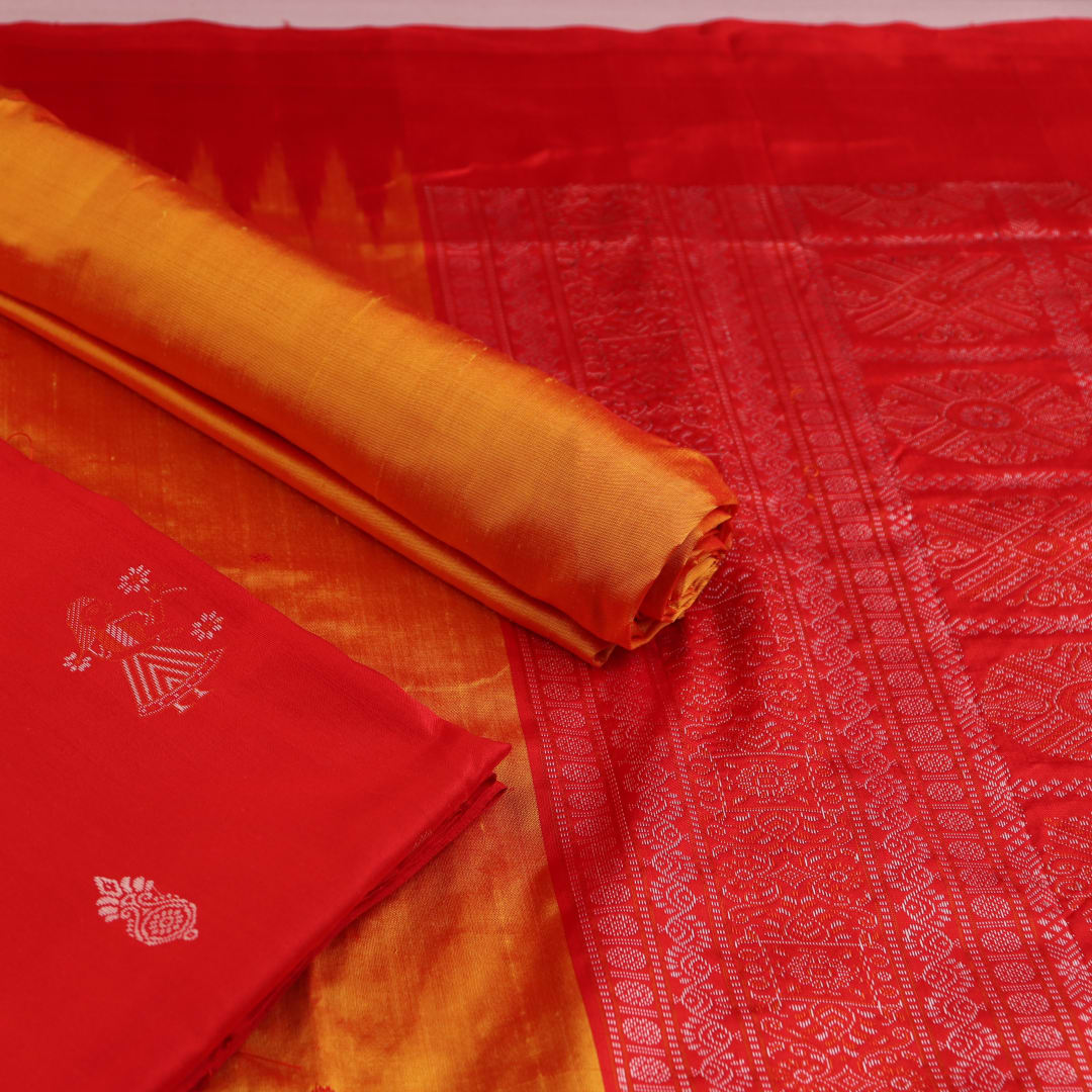 Red and yellow Bomkai silk dress material blouse piece with butta pattern.