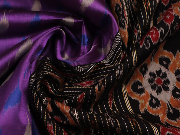 Full view of a violet and black Khandua silk saree showcasing its intricate motifs and elegant drape.