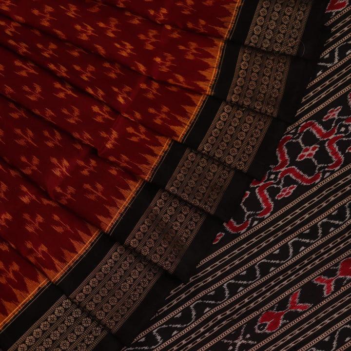 Close-up showing the fine silk texture and intricate motifs of the Sambalpuri saree