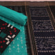 Detail of black cotton Sambalpuri dress material blouse piece with green Pasapalli pattern.