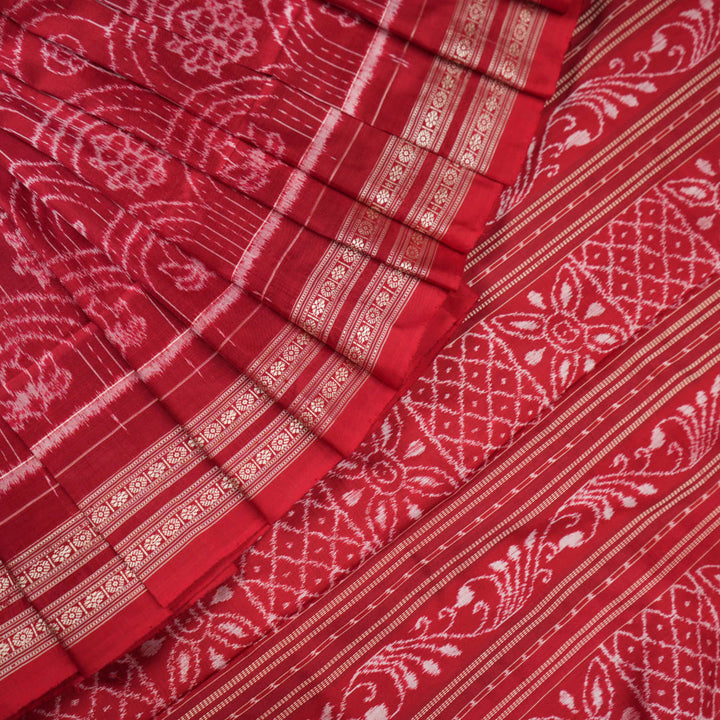 Full view of the maroon Sambalpuri silk saree with traditional motifs, displaying entire length and border.