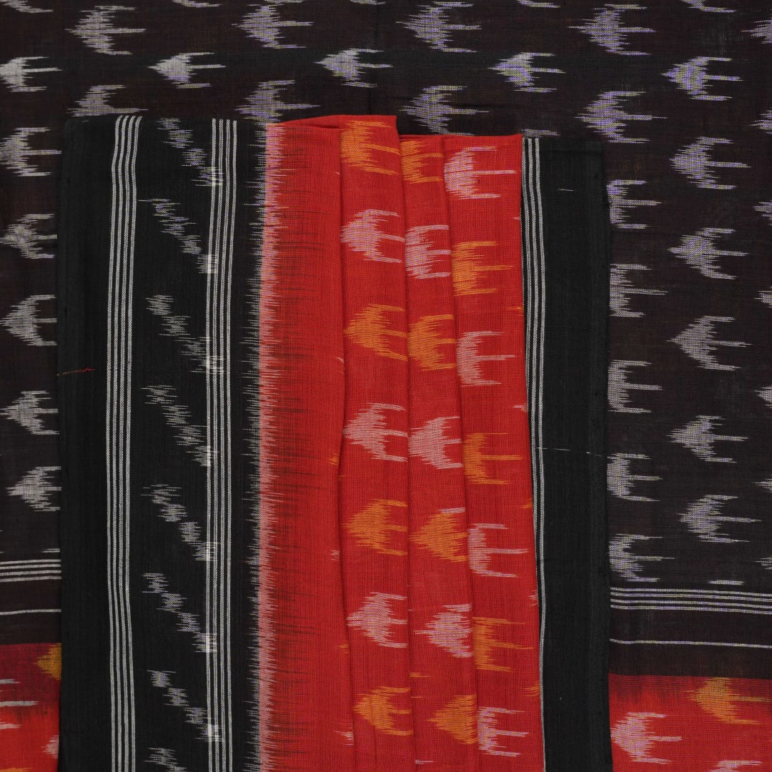 Model wearing a rust and black Sambalpuri cotton saree styled with traditional Odisha handloom motifs.