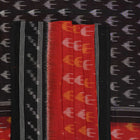 Model wearing a rust and black Sambalpuri cotton saree styled with traditional Odisha handloom motifs.