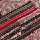 Off-white Sambalpuri cotton saree with green motifs, elegantly draped.
