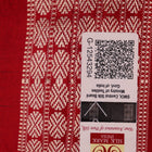 Close-up of grey Sambalpuri silk saree fabric showing intricate motif texture.