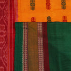 Full view of a white and green cotton handloom Bomkai saree with butta pattern.