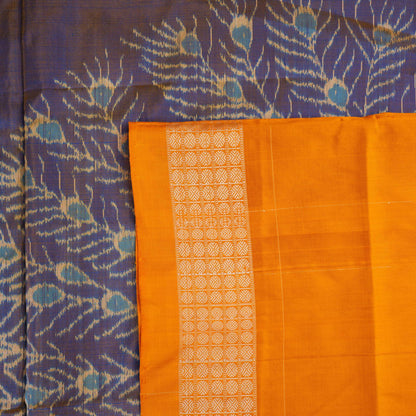 Close-up of the luxurious Sambalpuri silk fabric, highlighting its rich texture and handloom weave in blue and yellow.