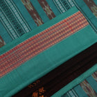 Full view of a brown and green Bomkai cotton saree with Doll pattern.