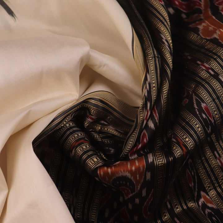 White Khandua silk saree draped, showcasing its plain body and simple elegance.