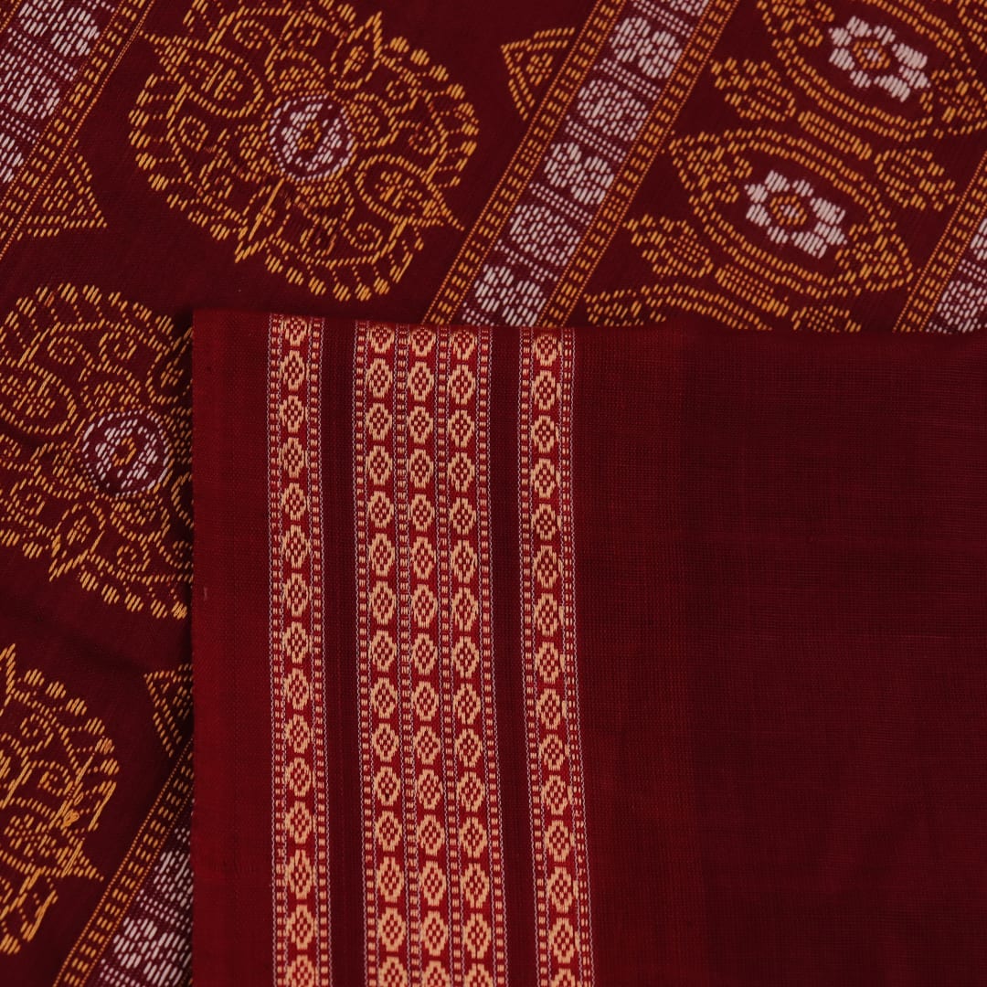 Full view of a blue and maroon Bomkai cotton saree with a butta pattern.