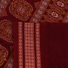 Full view of a blue and maroon Bomkai cotton saree with a butta pattern.
