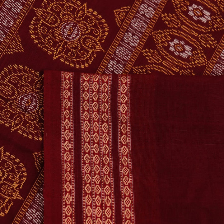 Full view of a blue and maroon Bomkai cotton saree with a butta pattern.