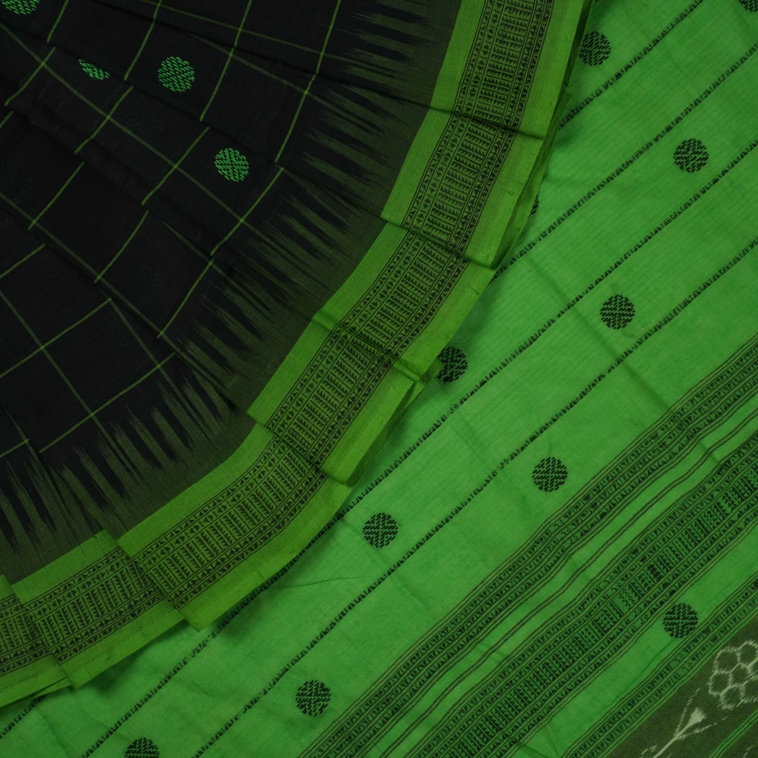 Full flat layout of a black Sambalpuri cotton saree with green butta patterns and an intricate ikat border.