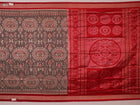 Close-up of grey Sambalpuri silk saree fabric showing intricate motif texture.