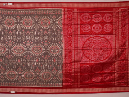 Close-up of grey Sambalpuri silk saree fabric showing intricate motif texture.