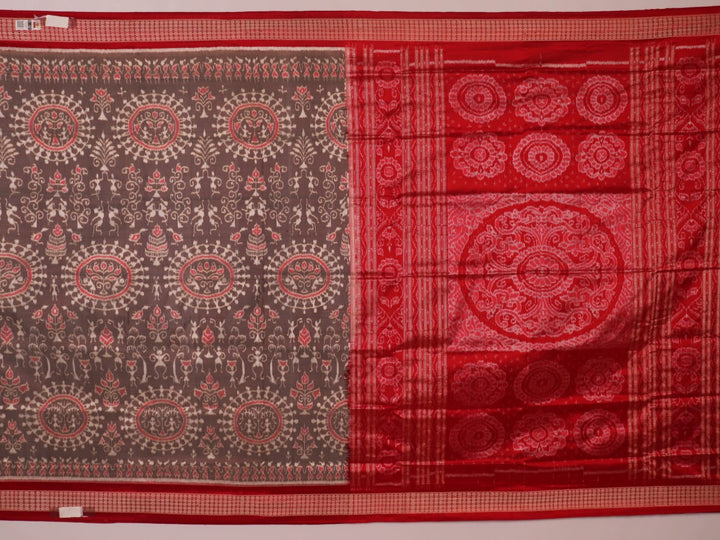 Close-up of grey Sambalpuri silk saree fabric showing intricate motif texture.