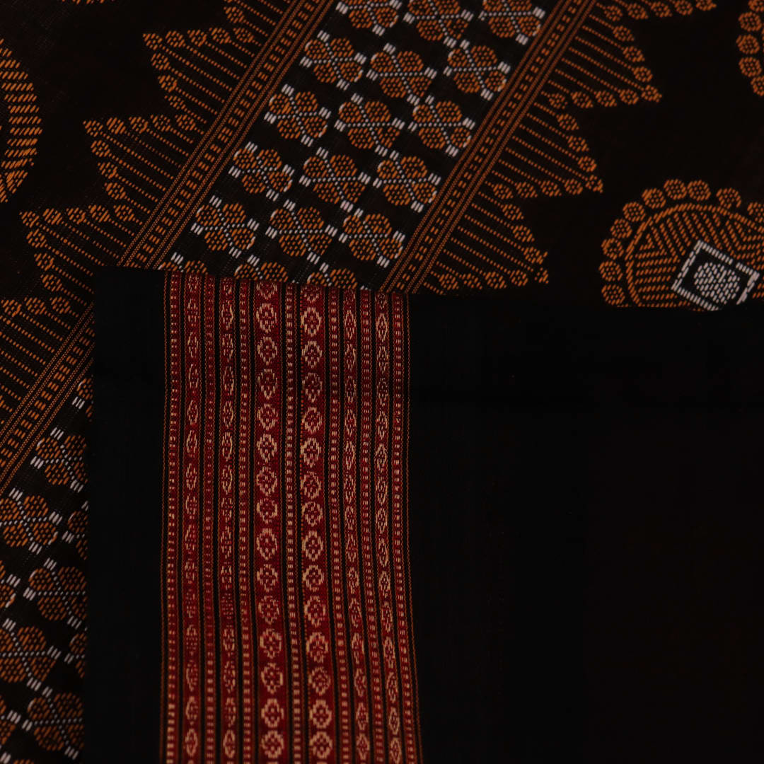 Full view of a pink and black cotton Bomkai saree with a Butta pattern.