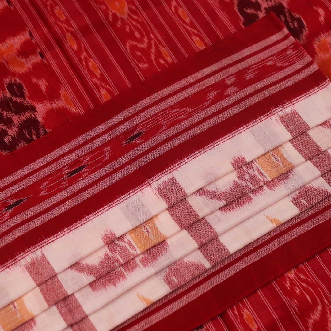 Full view of a white and red Sambalpuri cotton saree with traditional motifs.