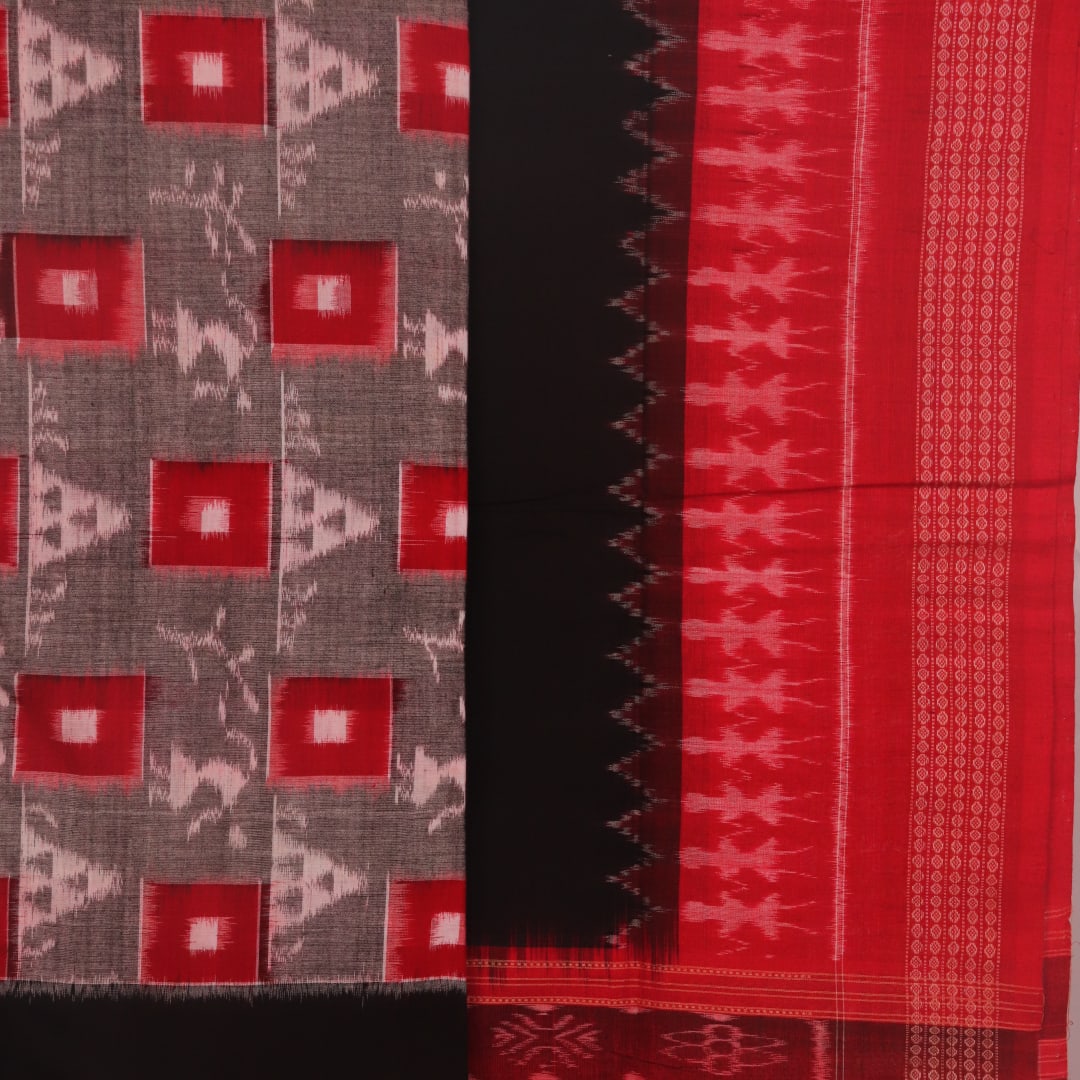 Detail of the grey and black Sambalpuri cotton dress material's blouse piece with motifs.