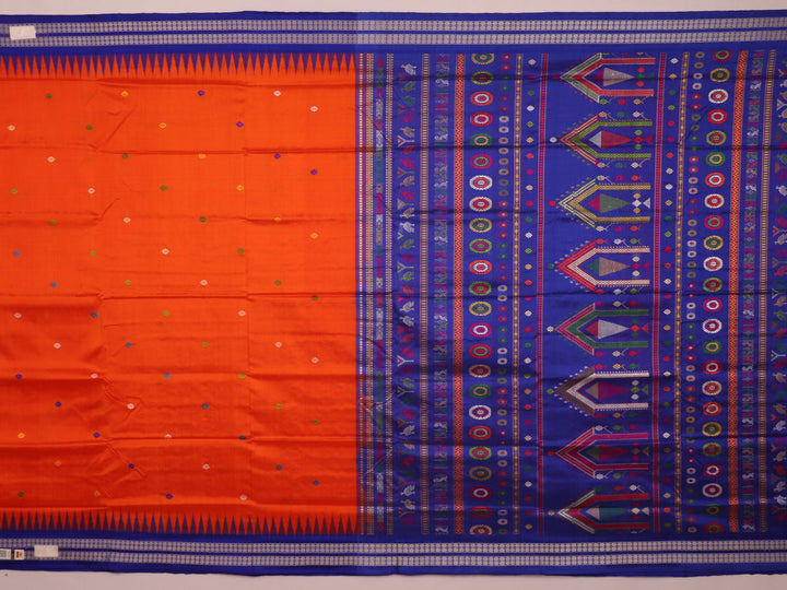 Close-up view of the vibrant orange and blue silk fabric texture with intricate butta pattern