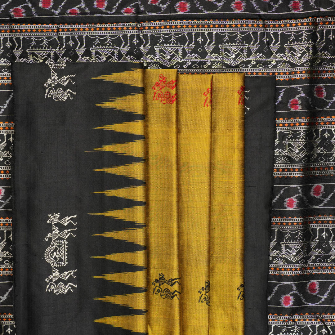 Macro close-up of Bomkai Silk Saree fabric, showing intricate brown & black silk weave.