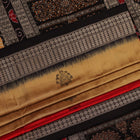 Close-up view of the vibrant and intricate silk fabric texture of a multicolored Bomkai silk saree with a black butta pattern.