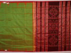 Close-up of plain green Sambalpuri silk saree fabric texture.