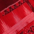 Styled plain pink and red Sambalpuri cotton saree, highlighting its elegant drape and material flow.