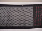 Model styled in a grey and black Sambalpuri cotton saree showing the elegant drape and traditional motifs.