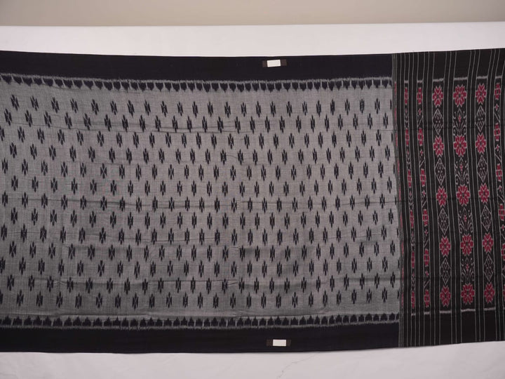 Model styled in a grey and black Sambalpuri cotton saree showing the elegant drape and traditional motifs.