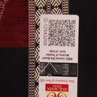 Detailed texture of handwoven Bomkai silk saree fabric in maroon and black with butta pattern.