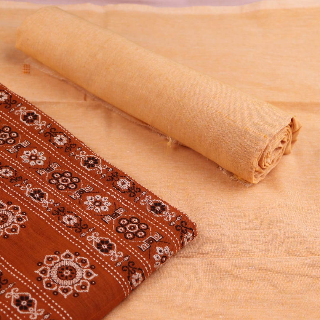 Matching blouse piece detail for the rust and cream Bomkai Cotton Dress Material, showcasing complementary weave.