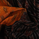 Woman draped in a yellow and black Sambalpuri cotton saree, showcasing the stylish drape and motif pattern.