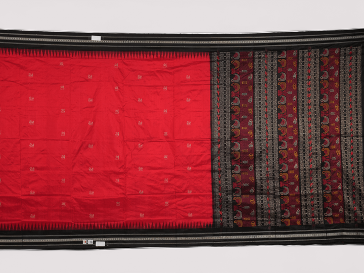 Extreme close-up revealing the fine handloom texture and intricate weave of the Bomkai silk fabric.