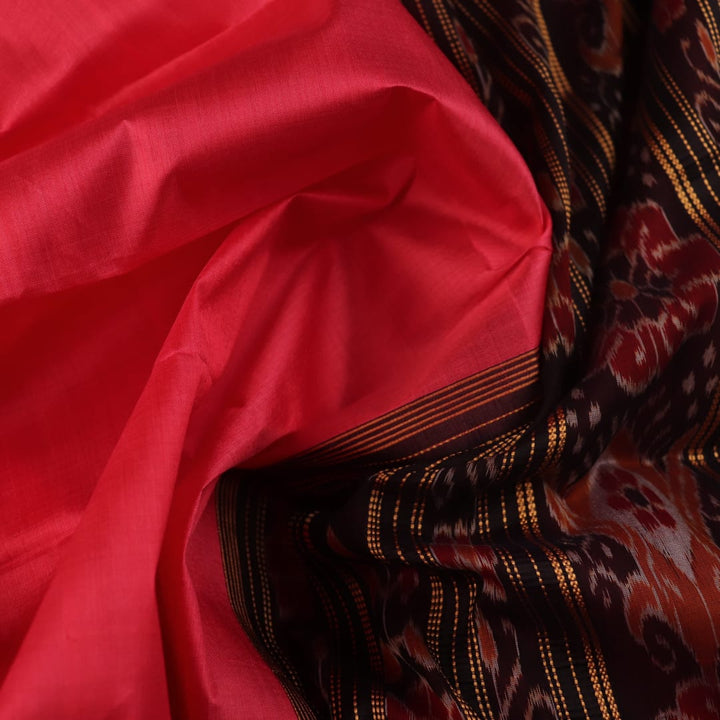Model wears a handloom pink Khandua silk saree, styled to showcase its simple elegance.