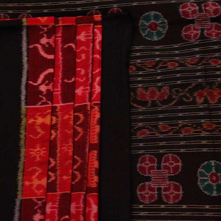 Full view of maroon and black cotton Sambalpuri saree showcasing intricate motifs on the body and border.