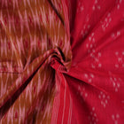 Model styled in a red multi-color Sambalpuri cotton saree featuring traditional hand-woven ikat motifs.