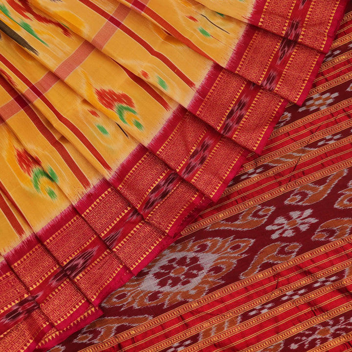Saree draped to showcase the Nabakothi pattern, red border, and multi-colored silk Khandua handloom artistry.